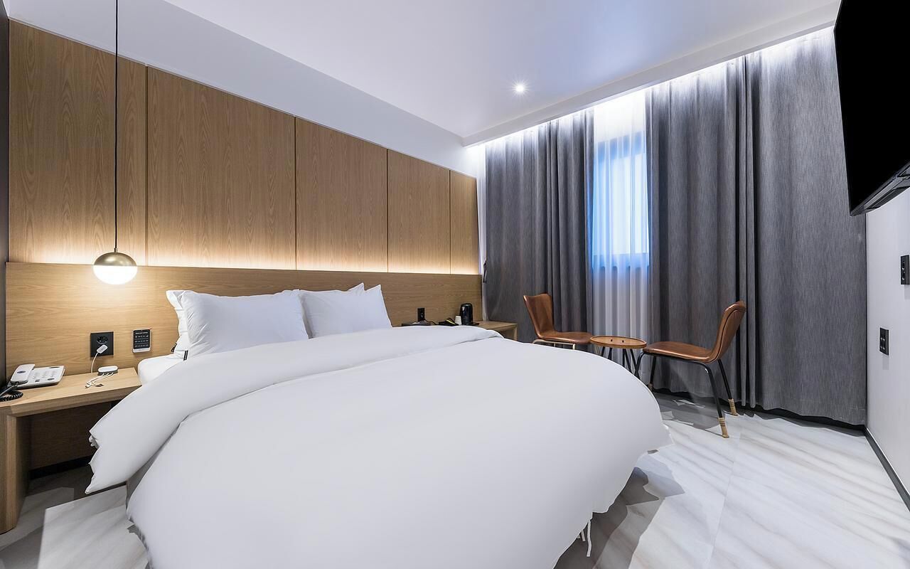 Premium bedding, down duvets, desk, laptop workspace