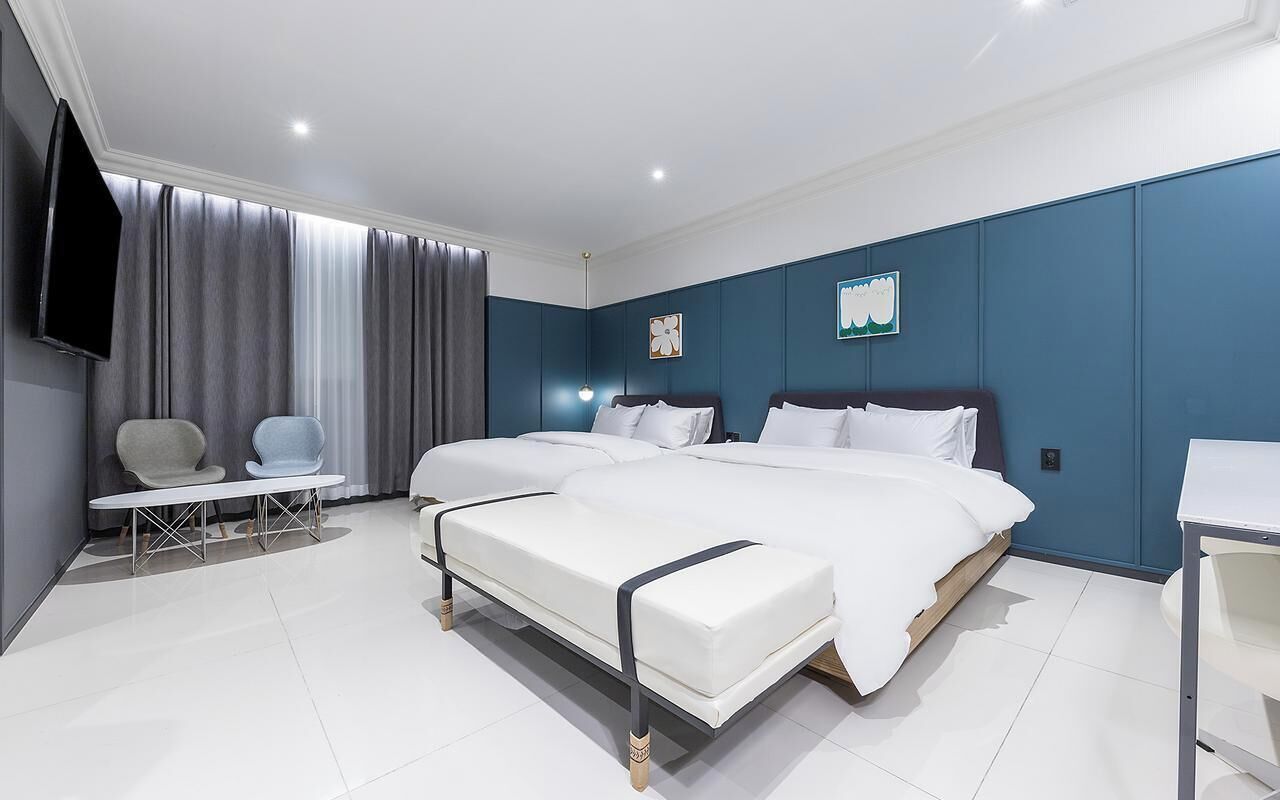 Premium bedding, down duvets, desk, laptop workspace
