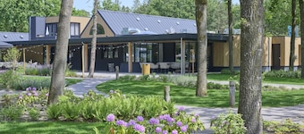 Cozy home in a holiday park with a swimming pool