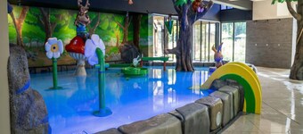 Cozy home in a holiday park with a swimming pool