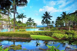 A resort with multiple swimming pools, palm trees, and a view of the ocean. - Beachfront Westin Kā‘anapali Resort + Amenities . STUDIO (Lahaina)