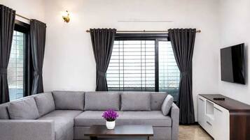 Luxury Villa | Living area | 40-inch LCD TV with cable channels
