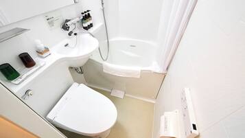 Combined shower/tub, free toiletries, hair dryer, slippers