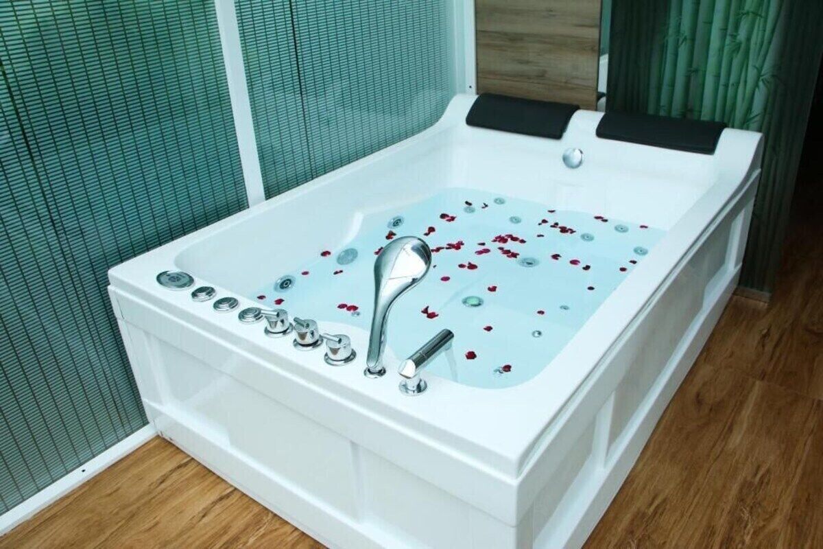 Shower, hair dryer, slippers, towels