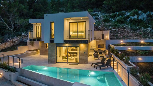A modern two-story house with a swimming pool, outdoor seating, and a dining area. - Villas Mare & Luce (Pijavičino)