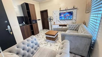 Deluxe appartement, balkon, uitzicht op stad | Woonruimte