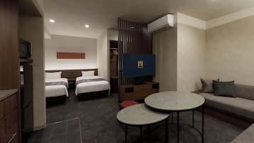 A hotel room with two beds, a sofa, a TV, and a small table.