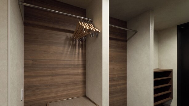 A walk-in closet with wooden paneling, a metal rod for hanging clothes, and a built-in shelf with a mesh bottom. - Premium MONday OSAKA SHINSAIBASHI (Osaka)