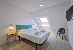 Premium bedding, down comforters, in-room safe, desk