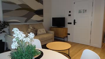 Superior Apartment | Living area | 32-inch Smart TV with digital channels