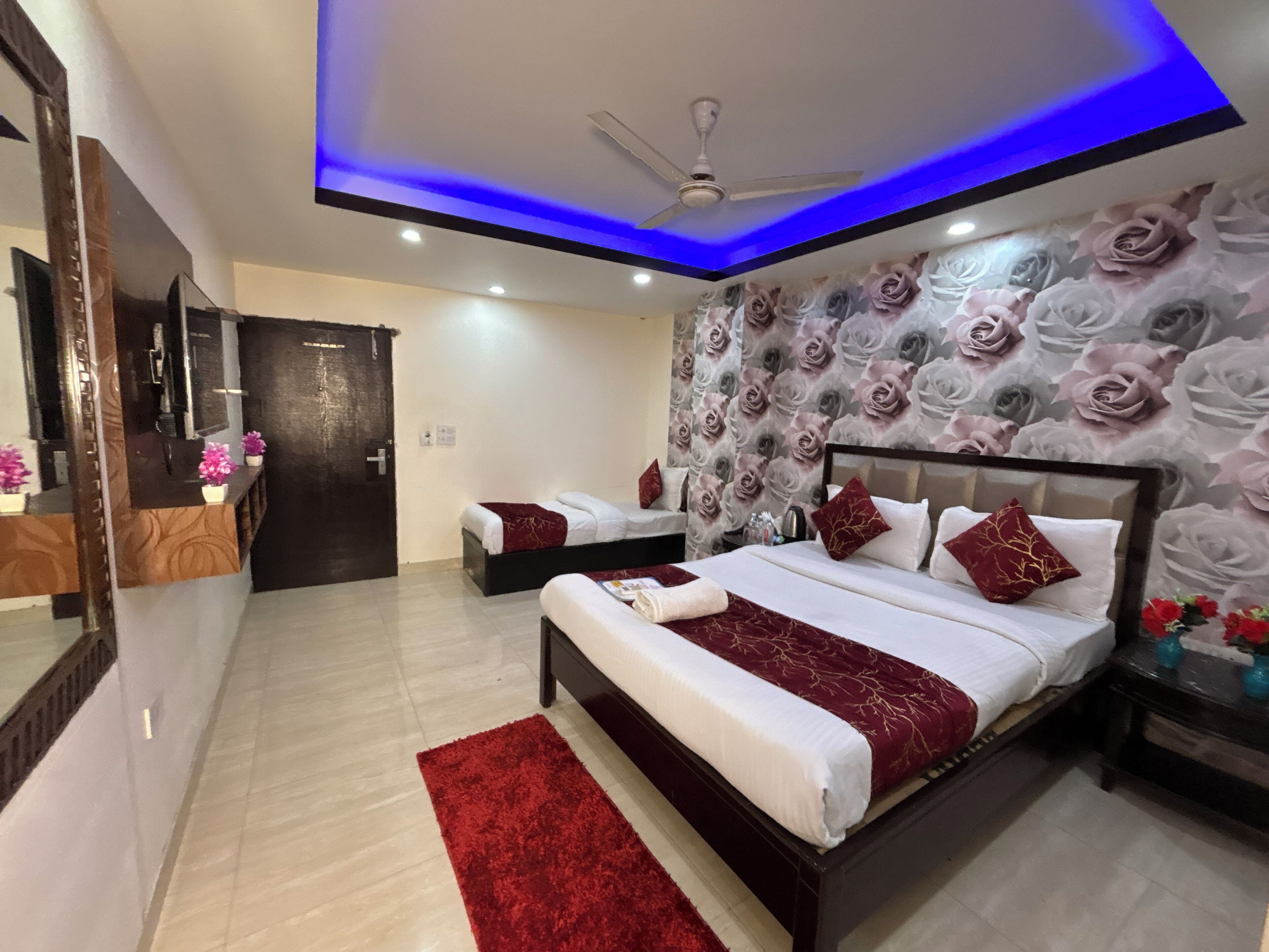 Deluxe Triple Room, Balcony, City View | In-room safe, desk, laptop workspace, blackout drapes