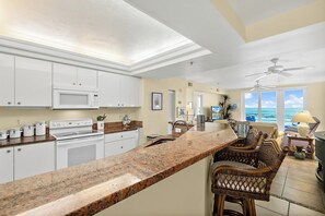 Fridge, microwave, oven, stovetop - Enjoy this beachfront 2BR condo in Ponce Inlet with a ground-level patio offering direct access to pool and beach. Features a heated pool, fitness room, and clubhouse. Master has a king bed with private bath; guest room includes a king and two twins (Ponce Inlet)