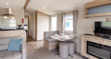 Silver Caravan with decking