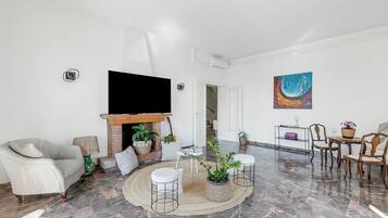 Family House, Multiple Bedrooms (Villa Talamone With Beautiful Sea) | Living area | Fireplace