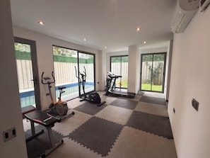 Apartment, Balcony | Fitness facility
