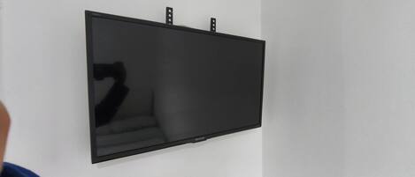 A flat-screen TV mounted on a wall.