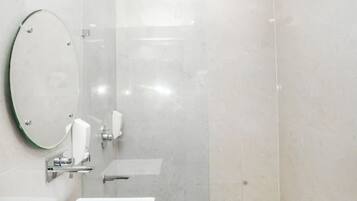 Shower, rainfall showerhead, slippers, towels