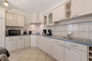 Fridge, microwave, oven, stovetop - Holiday Home "La Guinguette Du Bois" with Private Terrace, Garden, and Wi-Fi (La Caillère-Saint-Hilaire)