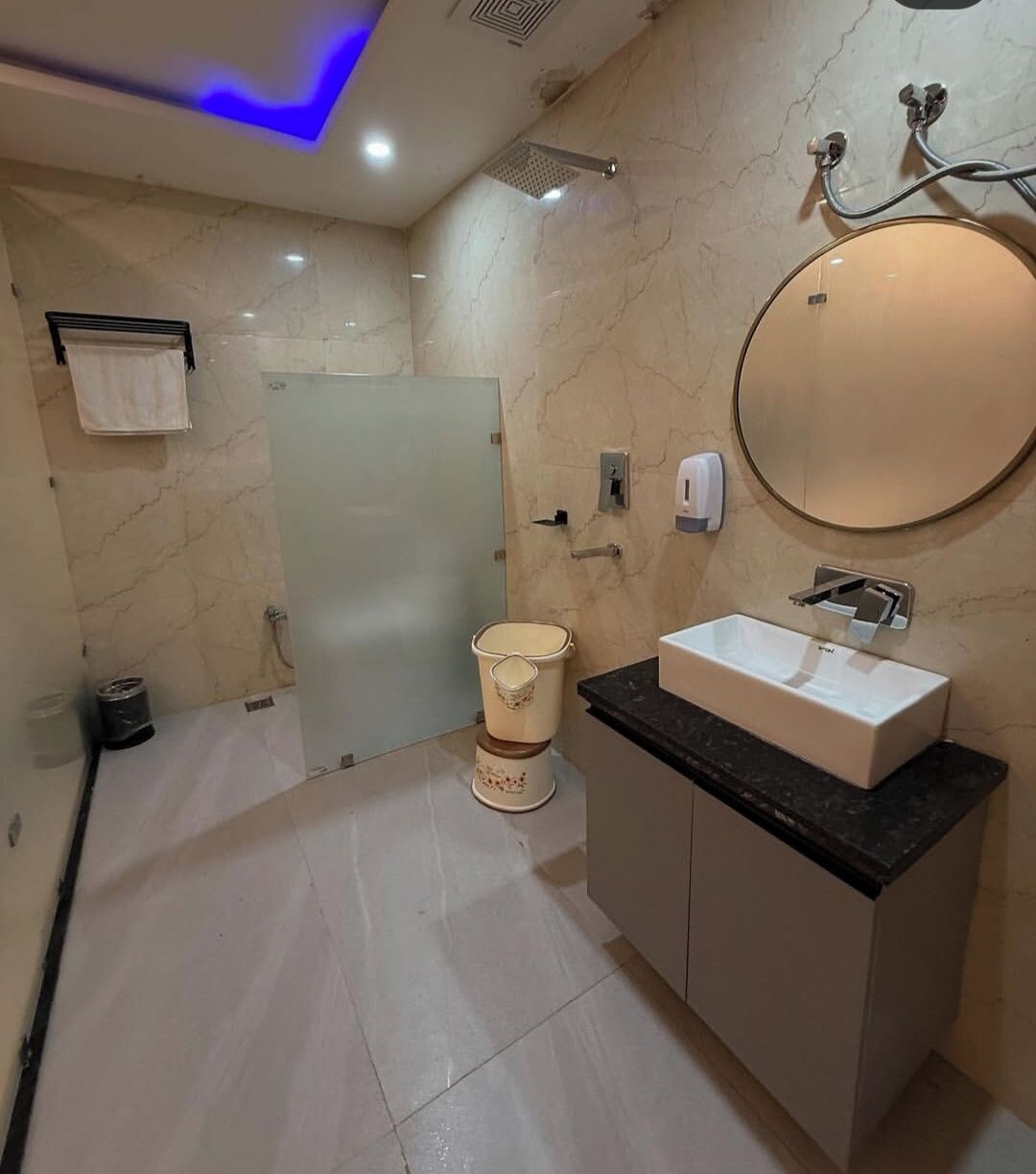 Shower, towels, soap, toilet paper
