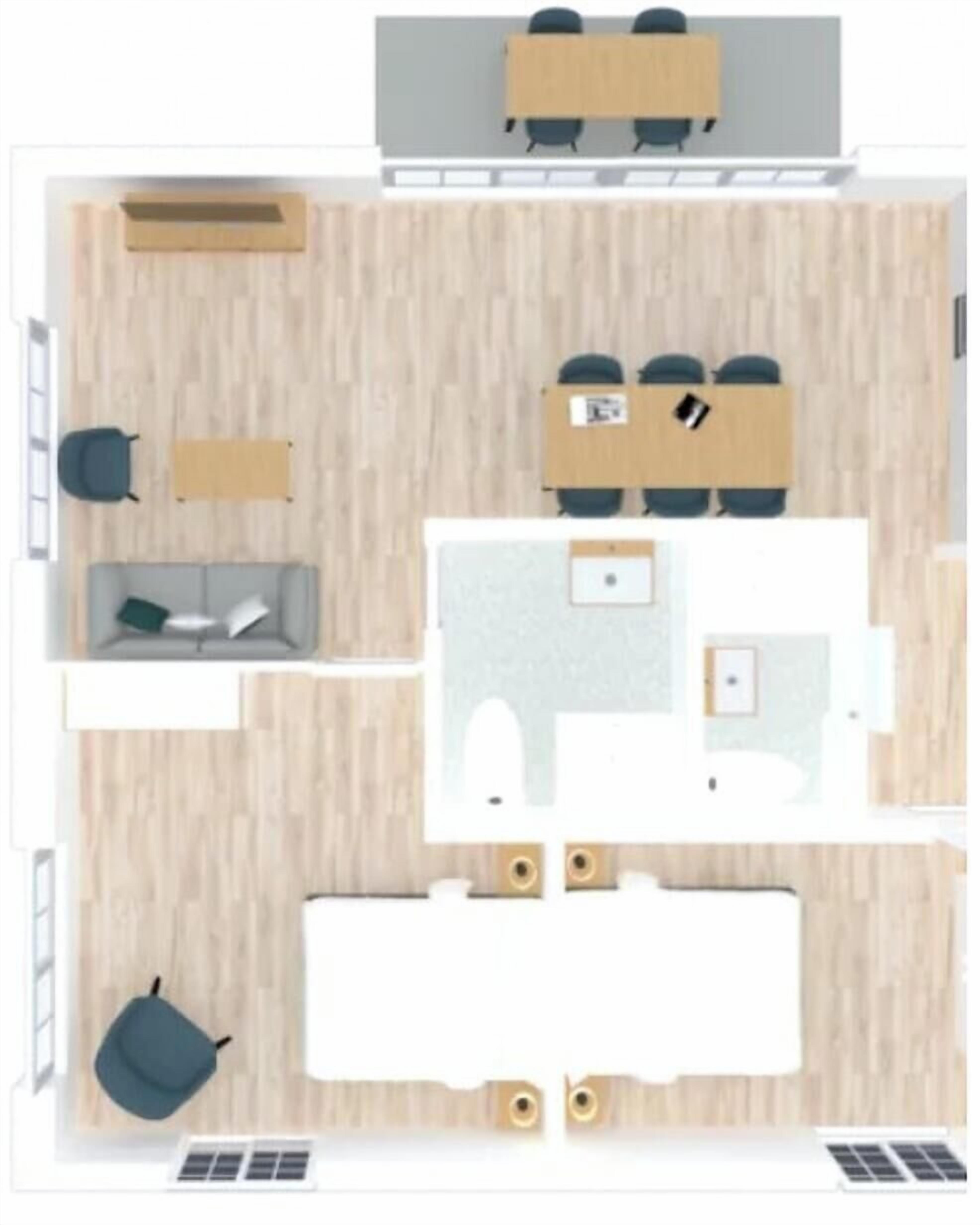 A room with a desk, chair, sofa, and a small table.