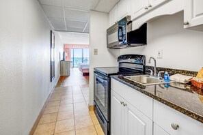 Fridge, microwave, oven, stovetop - Oceanfront 3rd Floor Room | King Bed | Kitchen | Dog Friendly (Myrtle Beach)