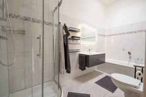 Shower, hair dryer, towels, soap