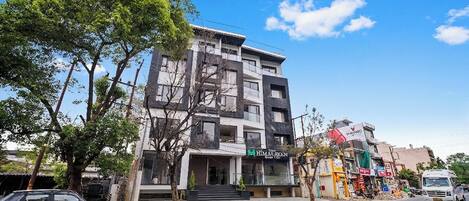 A multi-story building with a storefront labeled 'HIMALAYAN.'