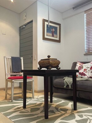 Room, 1 Bedroom, Smoking, Balcony | Living area | Books - Room-sweet Dreams Village Square (Cape Town)