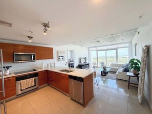Fridge, microwave, oven, stovetop - Bright 2BR Rooftop Pool · FIFA Fan Fest 15min (Miami)