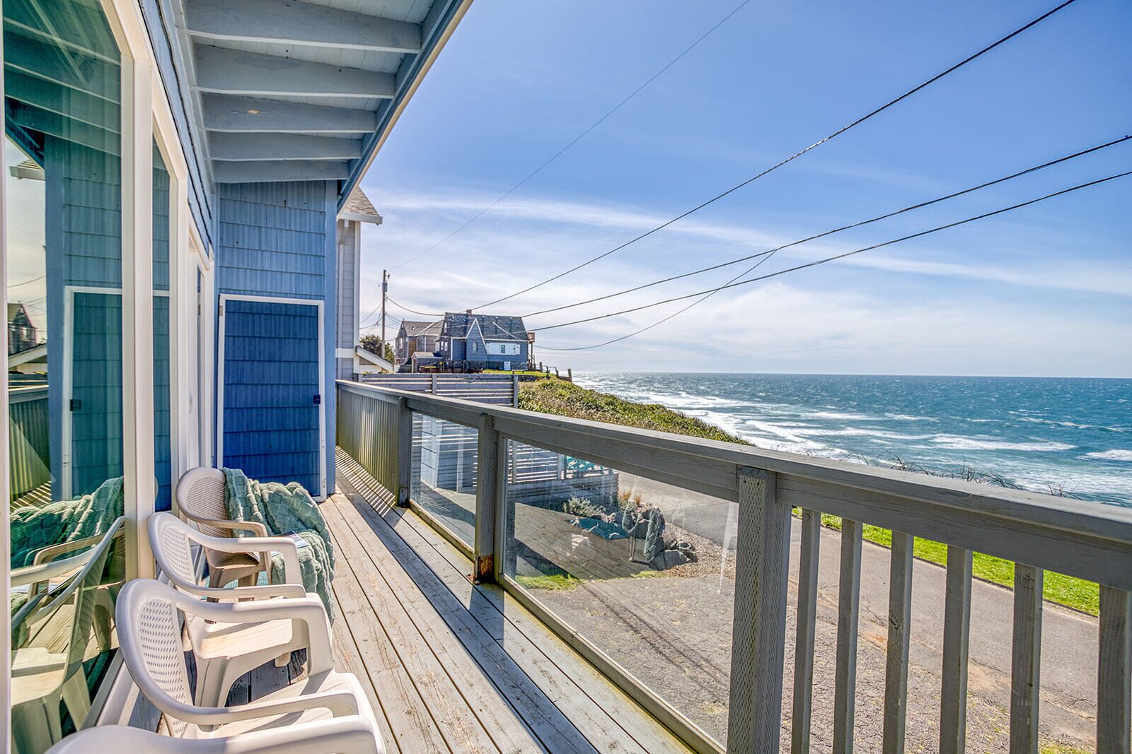 Breathtaking oceanfront balcony with comfortable seating where you can watch waves crash while sipping morning coffee or enjoying coastal sunsets.