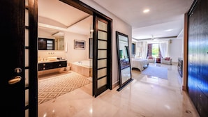 A modern hotel interior with a bathroom, a bedroom, and a living area. - Ground Floor Punta Mita Condo with Shared Pool (Punta Mita)