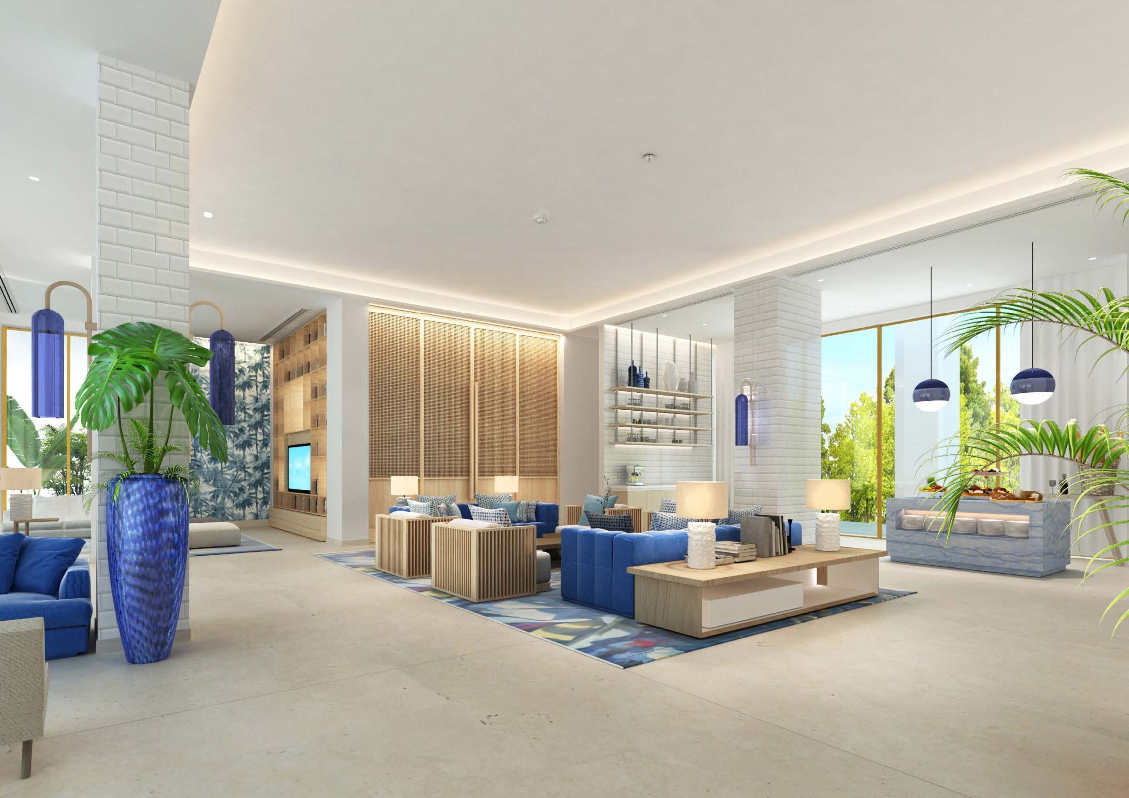 Una sala de estar moderna con un sofá azul, una mesa de centro y una planta grande en maceta.