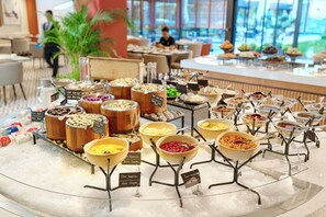 A buffet with various food options displayed in bowls and containers. - Crowne Plaza Istanbul Zeytinburnu By Ihg (Istanbul)
