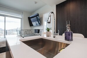 Interior - Modern 1-bedroom condo on Water St in downtown Kelowna, steps to the beach and park. Lake views, plus pool, sauna, steam room, gym, yoga studio, golf simulator & wine room. Walk to dining, shops & trails—perfect for a relaxing stay. (Kelowna)