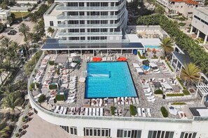 A heated pool - Luxury 18th-floor condo at the W Residences with panoramic ocean and Intracoastal views. Two king suites, full kitchen, in-unit laundry, and access to resort amenities including pools, spa, beach service, and fitness center. (Fort Lauderdale)