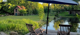 Glamping tent on a country house estate with pond and stream