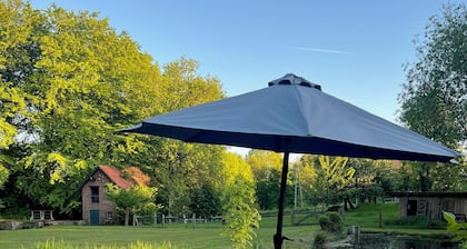 Glamping tent on a country house estate with pond and stream