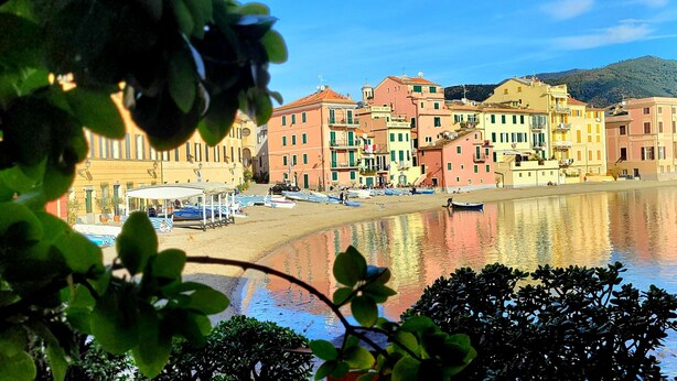 A coastal town with colorful buildings, a sandy beach, and a calm body of water. - "Ocean Blue" – A Gem with Unmatched Sea View, Wi-Fi & Air Conditioning (Sant'Andrea di Rovereto)