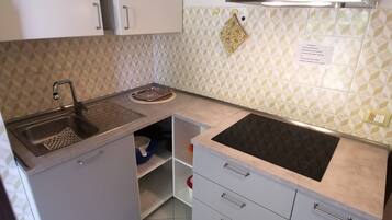 Fridge, stovetop, coffee/tea maker, cookware/dishes/utensils