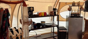 Cuddly cow yurt with fluffy cows, llamas, and sheep
