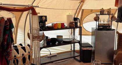 Cuddly cow yurt with fluffy cows, llamas, and sheep