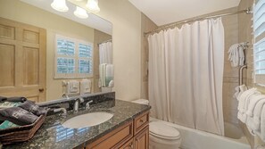 Combined shower/bathtub, towels, soap, shampoo