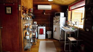 Fridge, microwave, coffee/tea maker, cookware/dishes/utensils