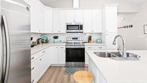House, Multiple Beds, Patio, Garden View (Beach Life) | Private kitchen - 3BR Home in Shorewalk: Pool, Grill, Arcade + Free Tix: Dolphin Cruise & More! (Panama City Beach)