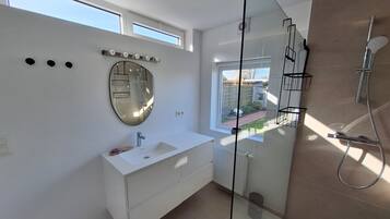 Shower, towels, soap, toilet paper