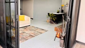 A modern interior with a reception desk, a sofa, and a coffee machine. - House Airy Luxury+WiFi+Amazing View At Alajuela CR (Provincia de Alajuela)