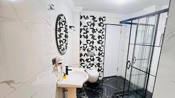 Shower, hair dryer, slippers, towels