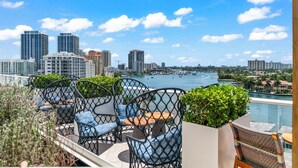 A rooftop terrace with outdoor seating, a view of the city skyline, and a marina. - 2 Bed/3 Bath Beach Townhouse  I 1600sqft I 5 Star amenities I No Resort fee I (Fort Lauderdale)
