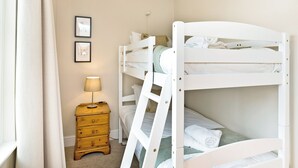 A bunk bed room with a bedside table and a lamp. - 5 bedroom accommodation in Carsington, near Ashbourne (Carsington, near Ashbourne)