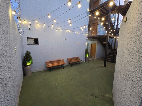 Fully equipped apartment with air conditioning, linens, laundry facilities, and a grocery store.